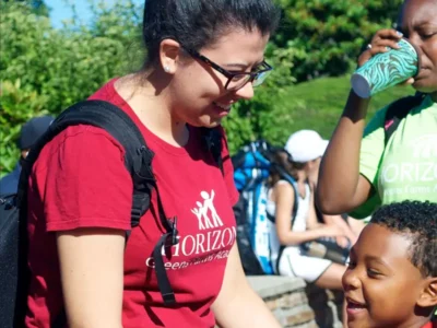 Brenda greeting a student at Horizons GFA