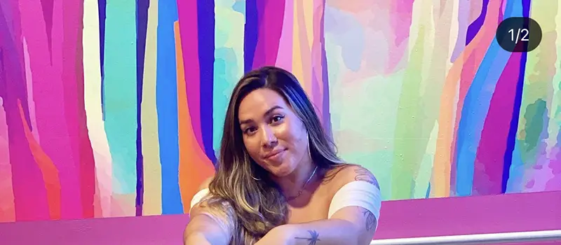 Cynthia in front of colorful background