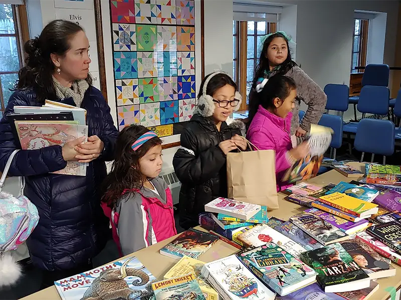 Students and parents pick out books at Reading Celebration