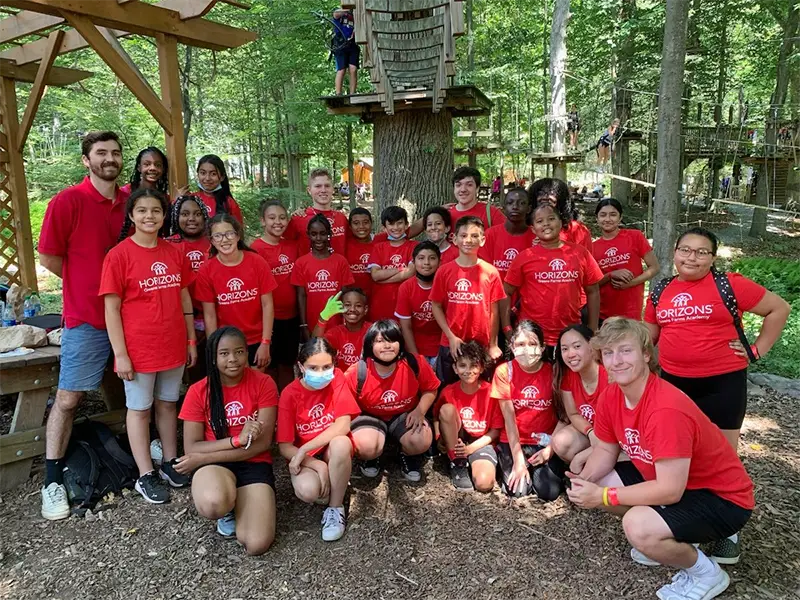 Mike with a group of students in red t-shirts
